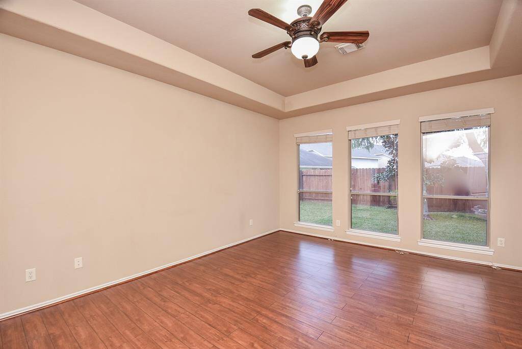 Master Bedroom with beautiful engineered wood floors and lots of natural light