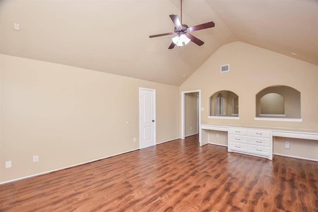 Game room with built-ins and brand new wood finish floors