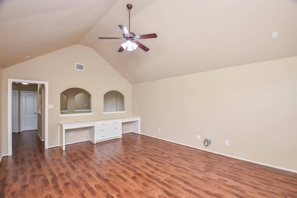 Game room with built-ins and brand new wood finish floors