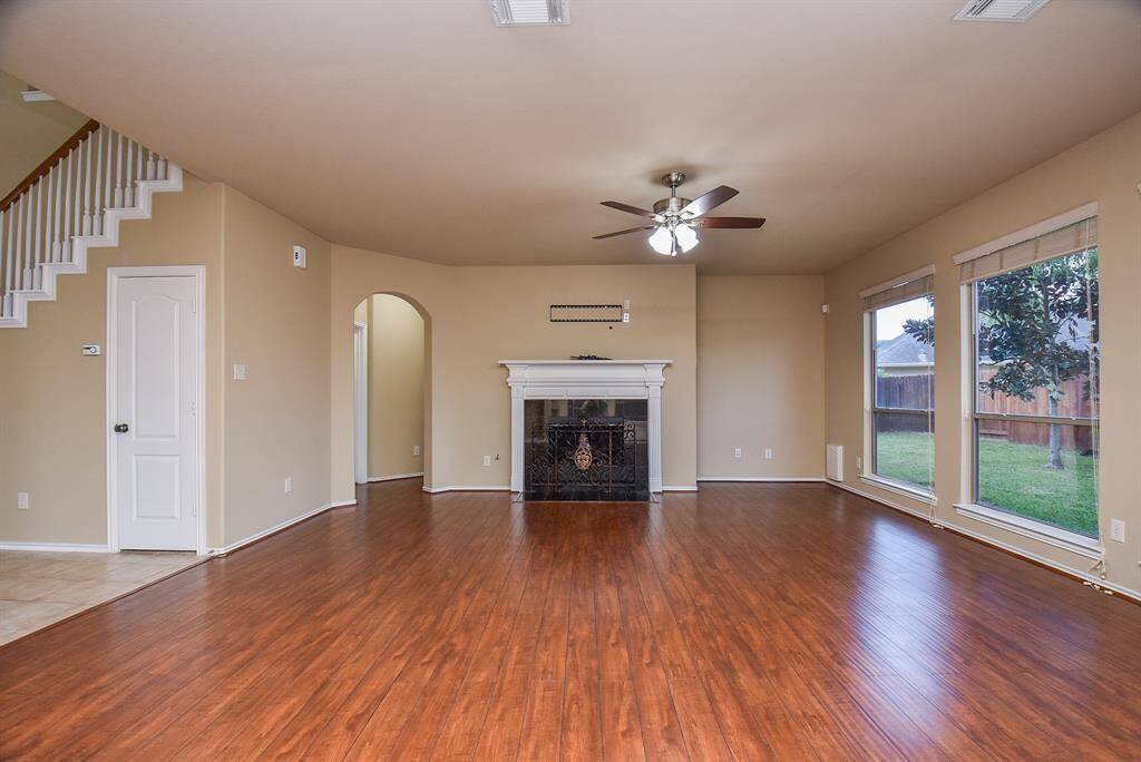 Living Room with beautiful Engineered Wood floors plus fire place