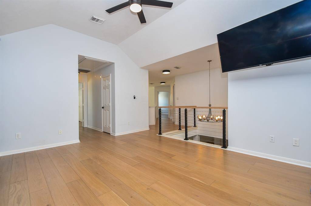 Hallway leads from gameroom towards secondary bedroom