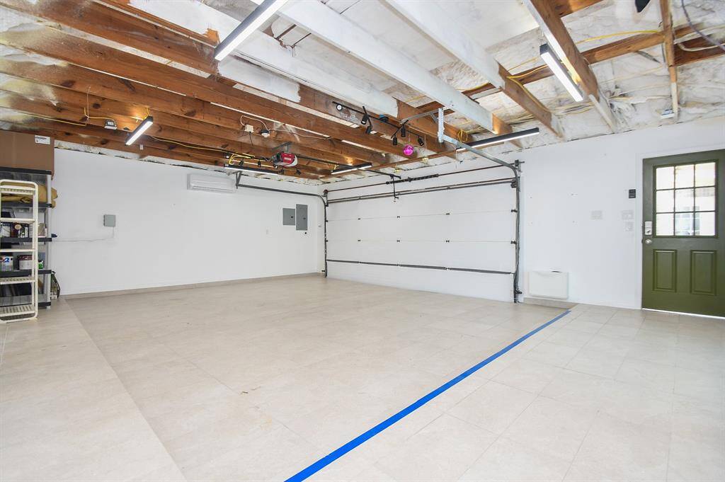 Foam insulated ceiling with split A/C system, tiled flooring, doors to pool area and a patio