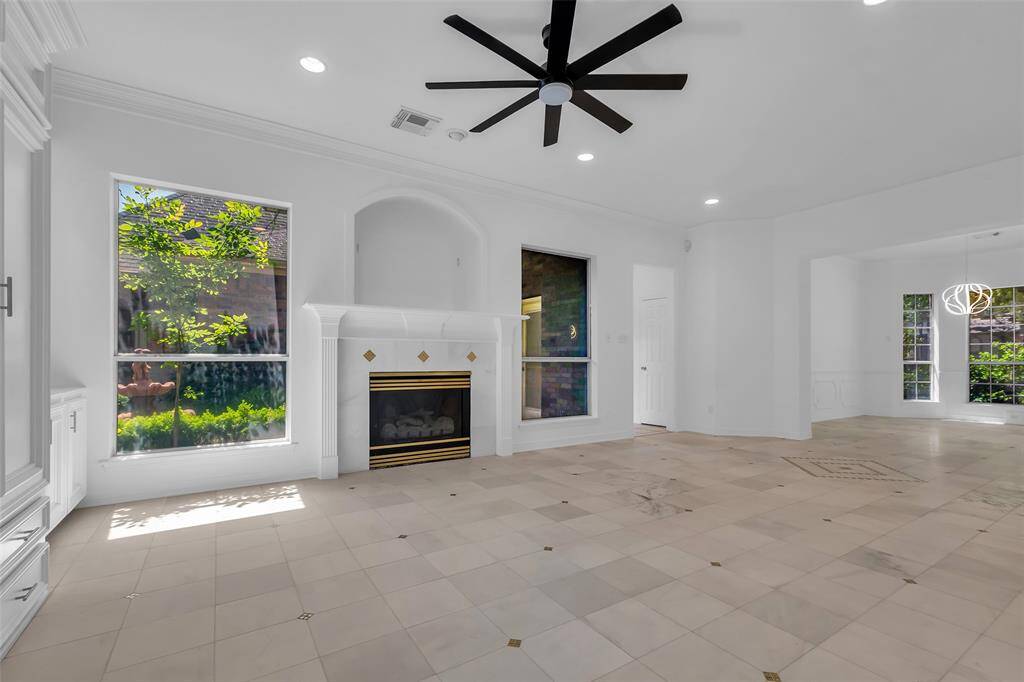 Game room/family area with big windows looking out to the courtyard.