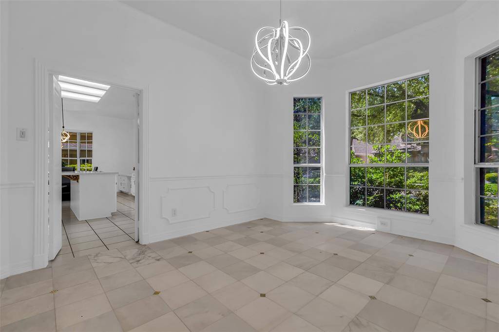 Dining room offering a clean and contemporary look.  Marble flooring provides elegance and easy of cleaning!