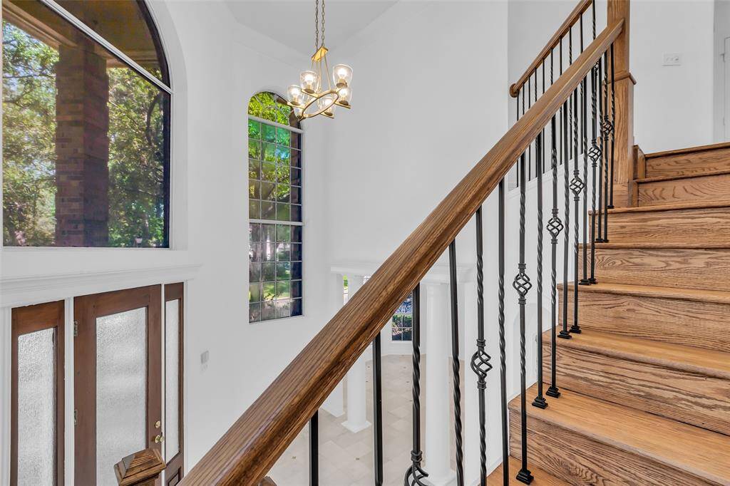 New wrought iron balusters and the stairs recently refinished.