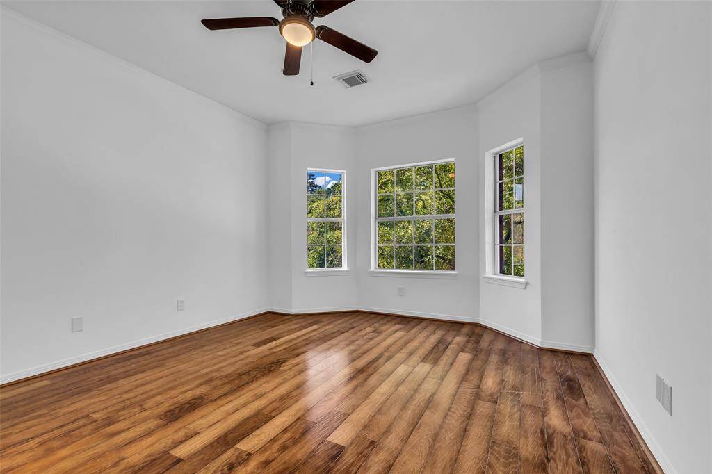 2nd bedroom upstairs with nice windows for natural light.