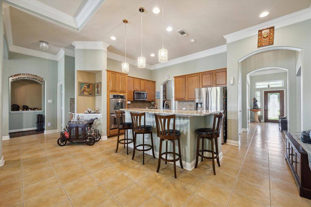 kitchen, Breakfast bar and hallway with beautiful tile floor
