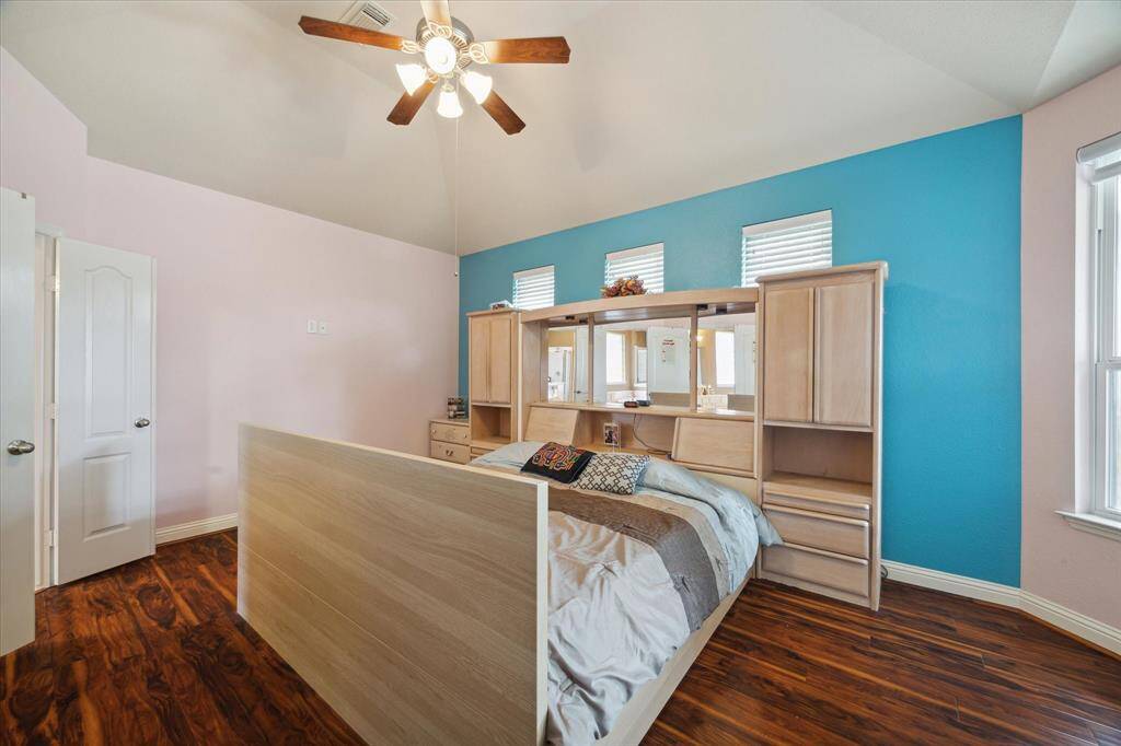 Bed can be moved to other wall to open three more windows for more light.