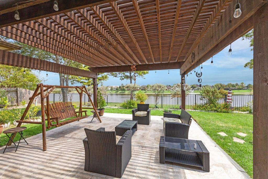 Pergola and swing to enjoy cool breeze from the lake