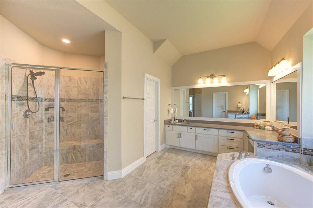 Sleek, luxurious Primary Bathroom