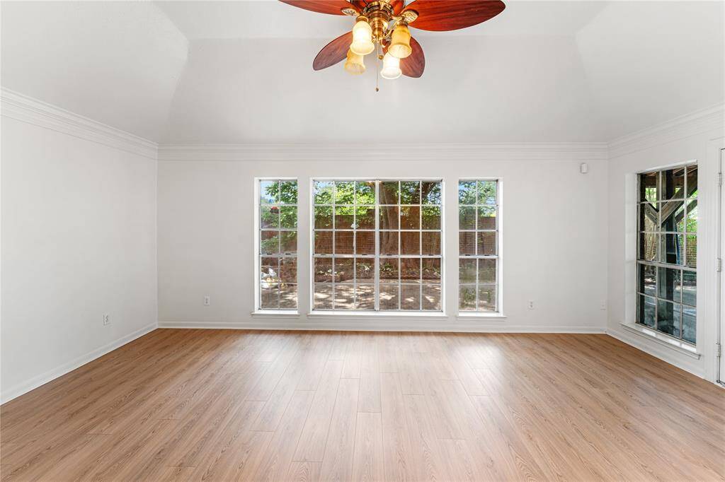 The primary bedroom includes a walk-in closet and large windows.