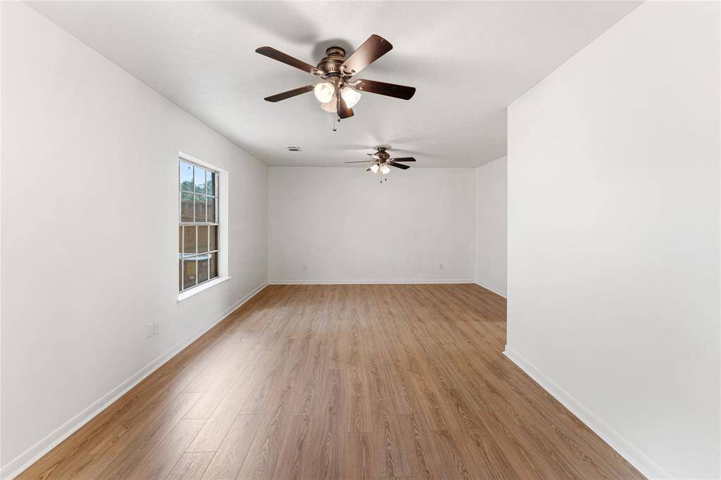 This combined third and fourth bedroom can be used as a study/office or game room. Each room has its own set of doors.