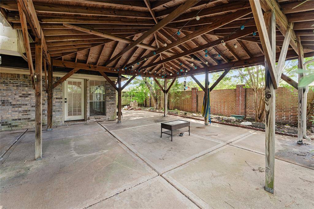 This covered patio can be used for relaxation or entertaining, with year-round shade and comfort.
