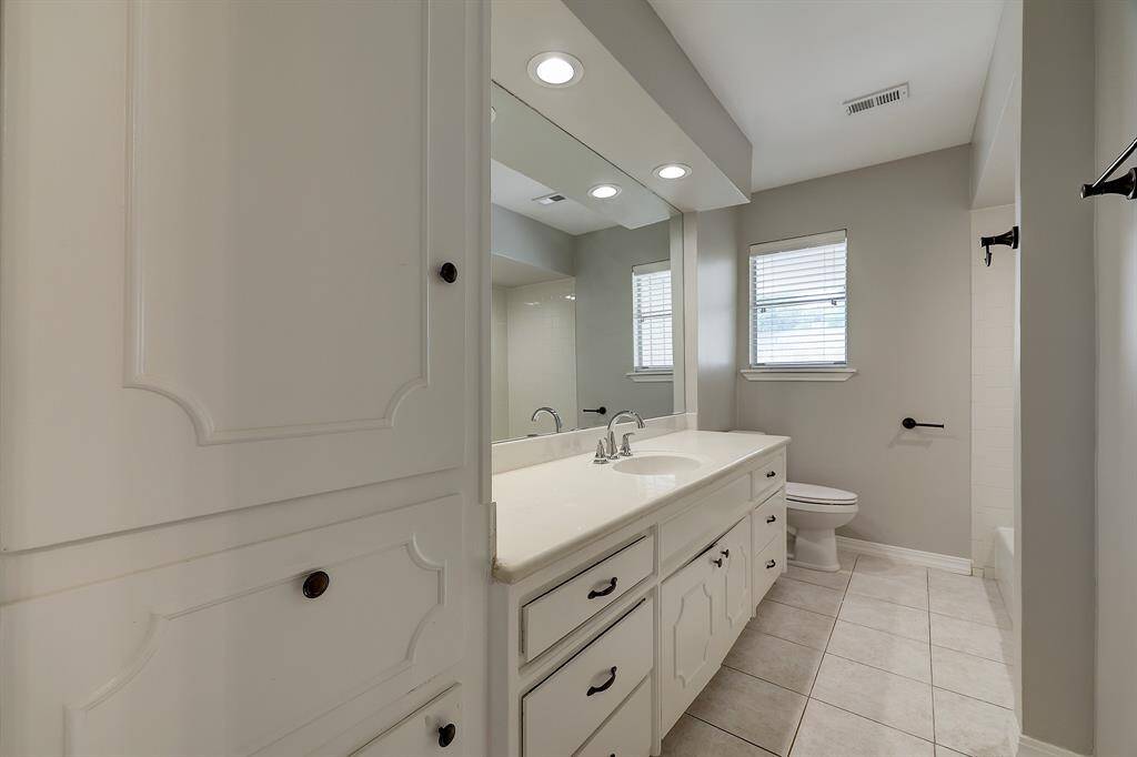 Front bedroom with built-ins and 2 closets