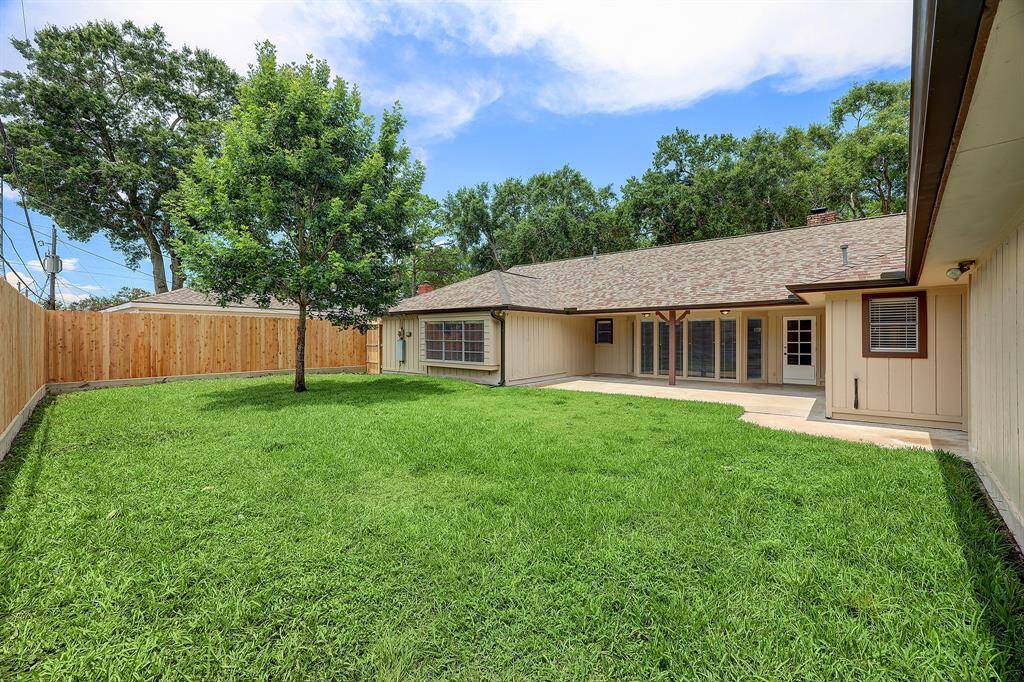 Get ready to relax and host some BBQ's in this lovely backyard w/covered patio a
