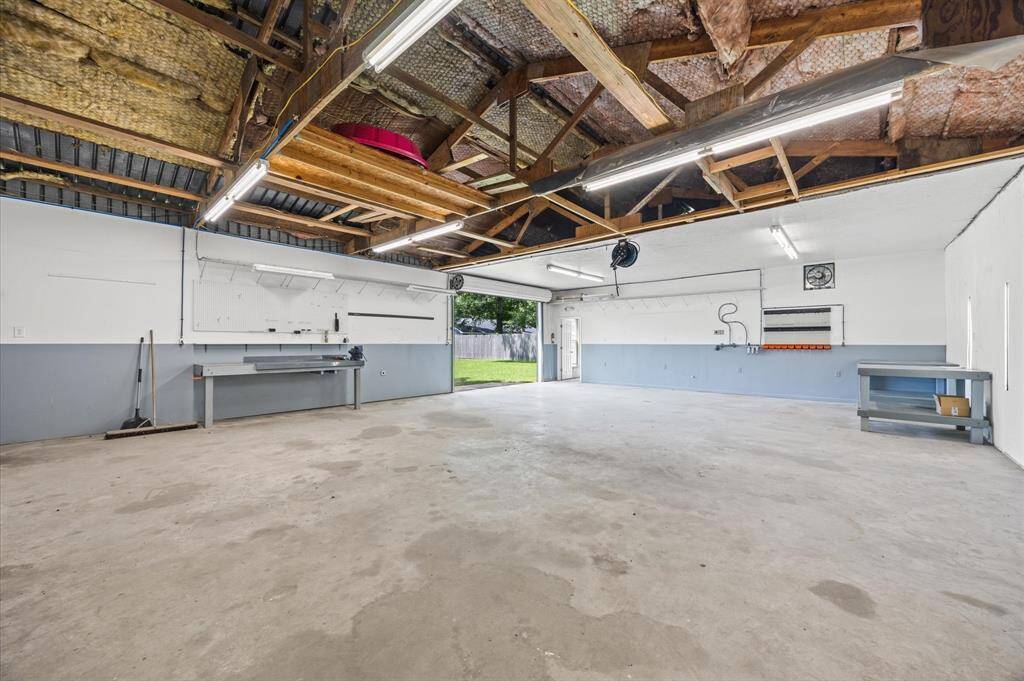 Two bay doors, one with a view of the pool