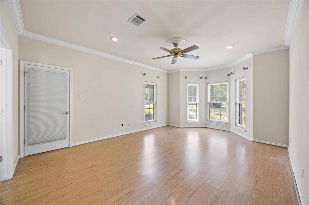 Primary bath features garden tub, double sink vanity, Walk-in closet with built in closet system