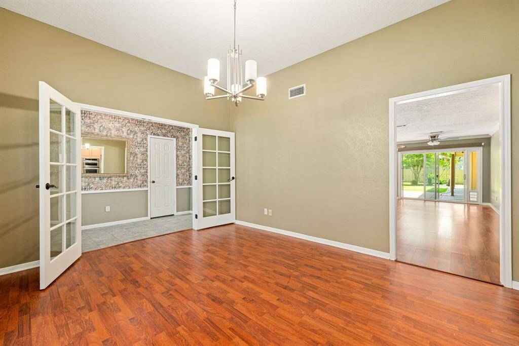 Formal dining with French doors that opens in the kitchen and living area.  Great for entertaining.