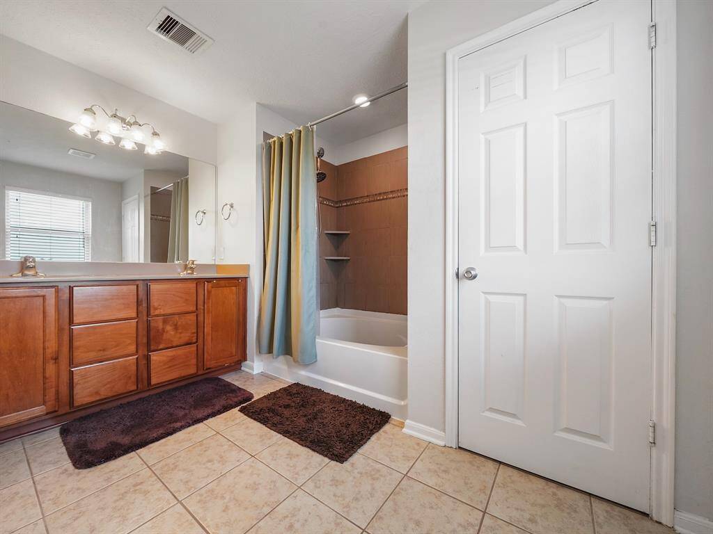 Primary bedroom shower tub combo.