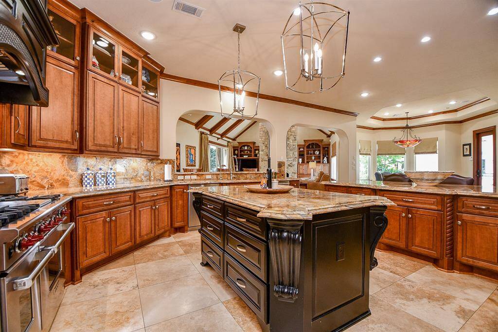 Large island kitchen with tons of counter space and breakfast bar.