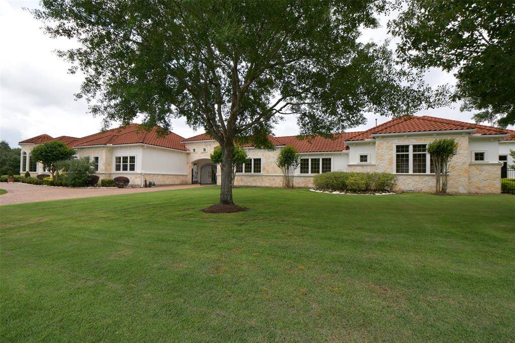 Beautiful curb appeal, large circular driveway shows great pride of ownership.