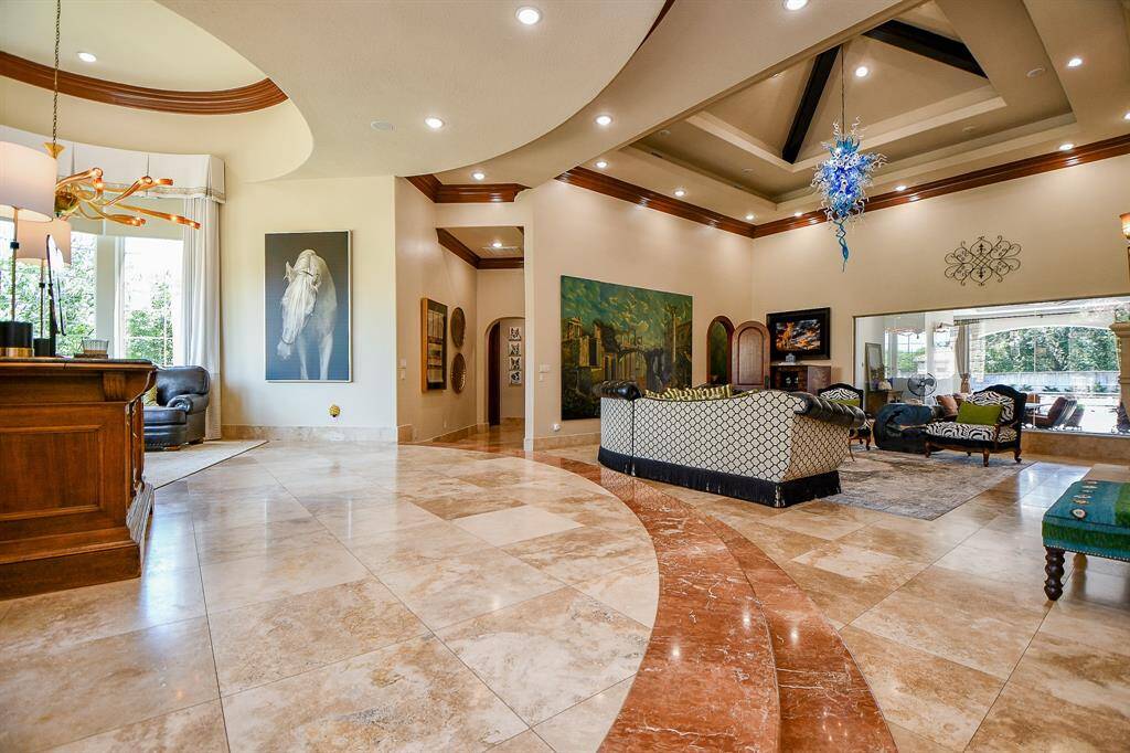 As you enter the home you see a rotunda and a formal living room.