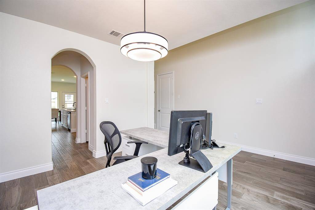 Immediately to your left is your open home office/study or formal dining room. Measuring 11' x 12', this bright and versatile space is perfect for remote work, homework sessions, or formal dining with easy access to the kitchen. It also has newly installed chandelier!