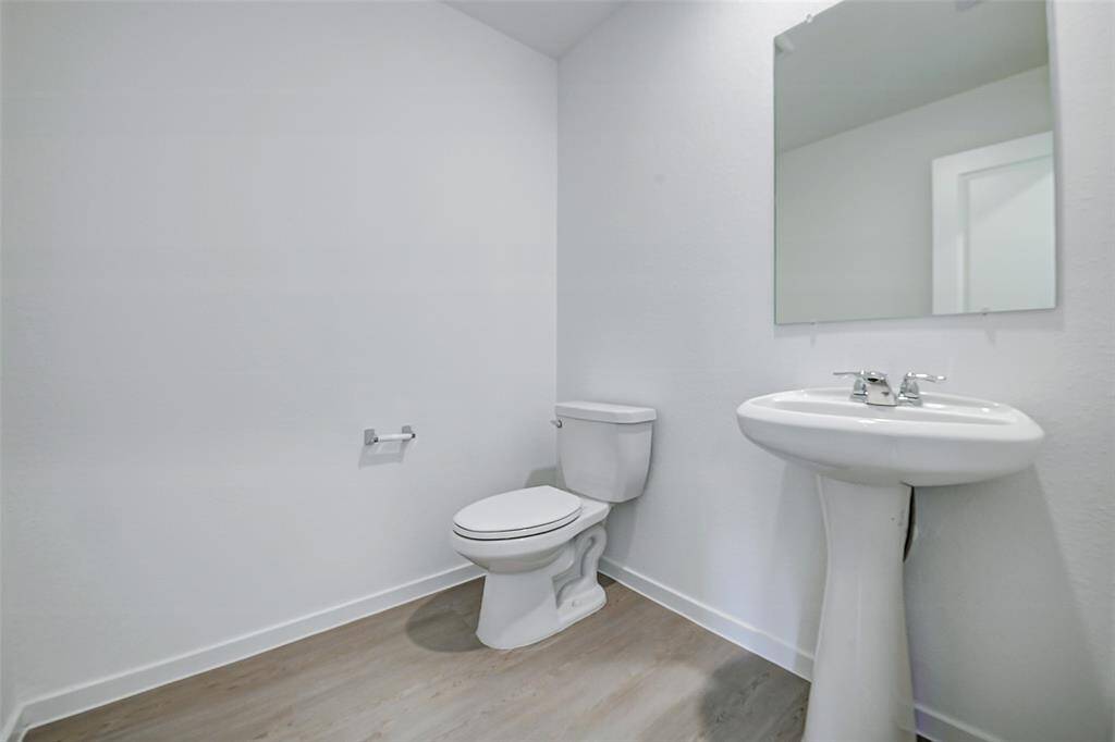 Half bath on the first floor for guests.