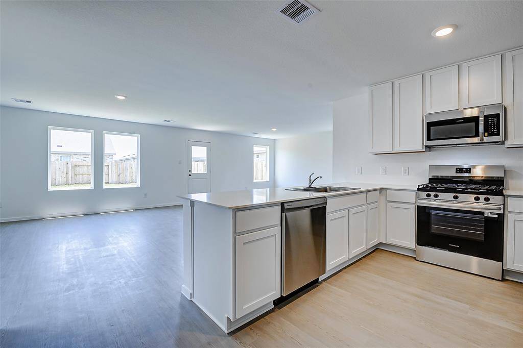 KItchen over looks the living room area.