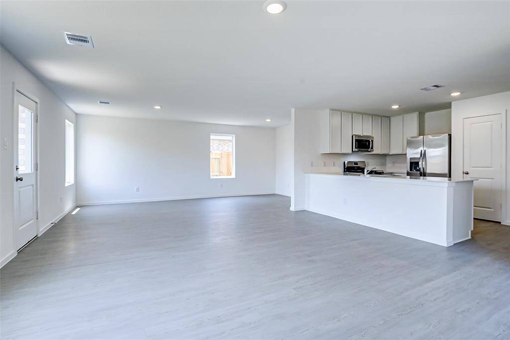 Enough space for a dining room table & desk area.