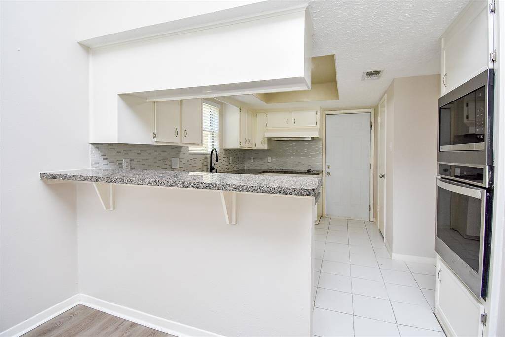 Updated Kitchen with granite & new hardware on sink