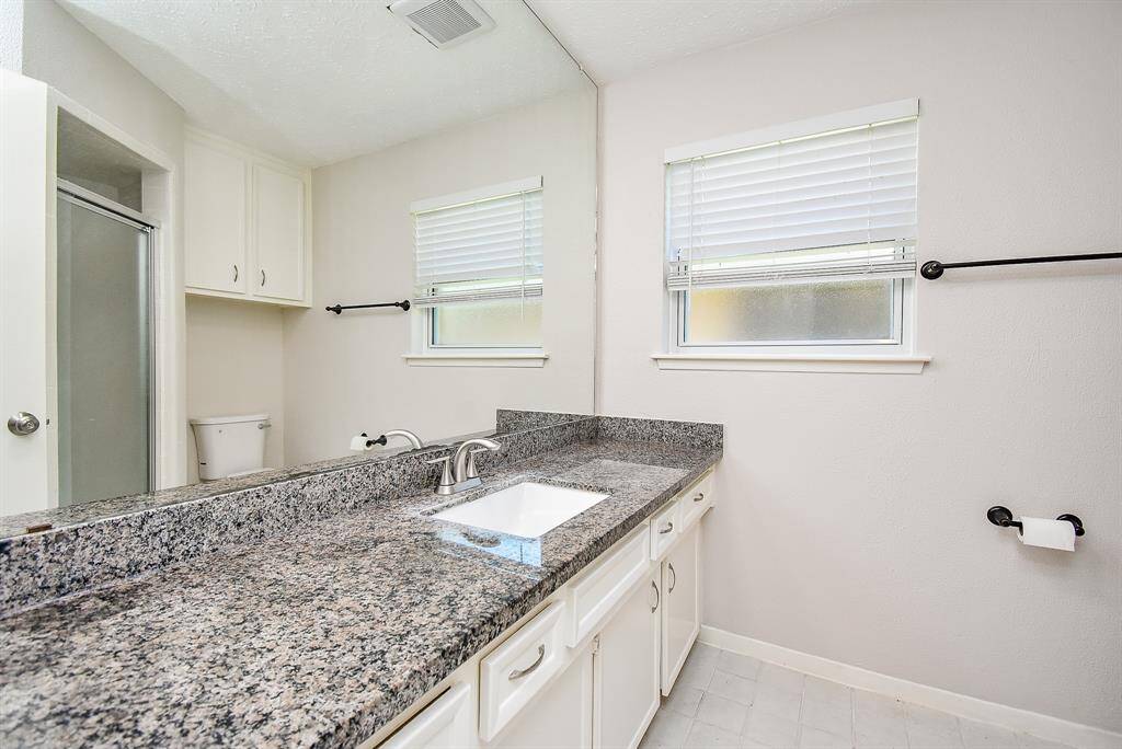 Primary bathroom features walk in shower