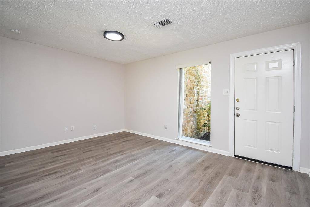 Luxury vinyl plank flooring throughout the updated interior.