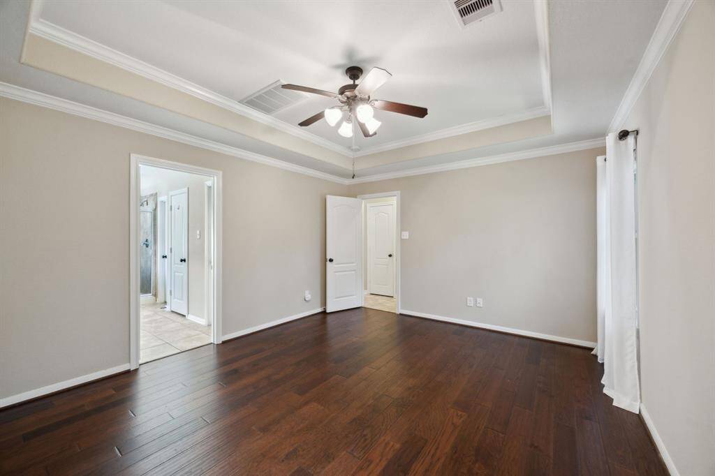 Primary bedroom and all of the downstairs has beautiful hard surface flooring!