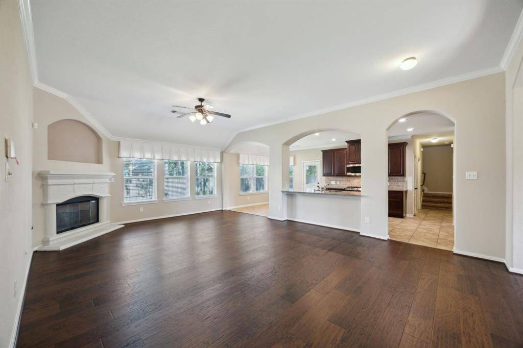 Note the beautiful and durable flooring and great open space of the living area adjacent to a spacious kitchen and two eating areas!