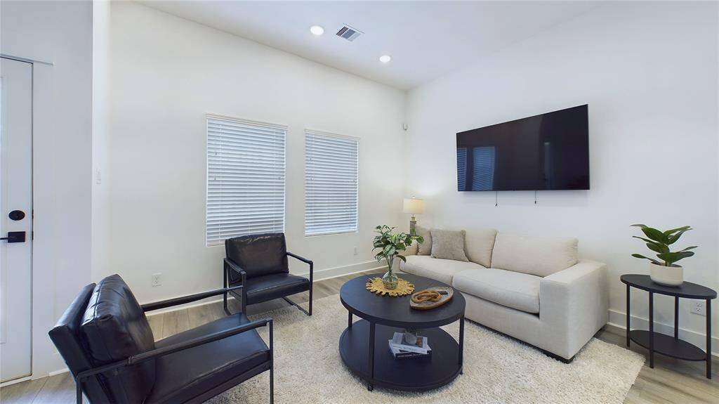 Open concept area with access to the backyard, perfect for entertaining and family gatherings.