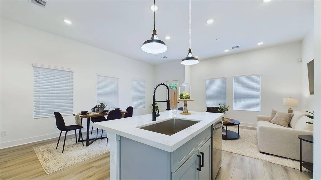 Open concept area with access to the backyard, perfect for entertaining and family gatherings.