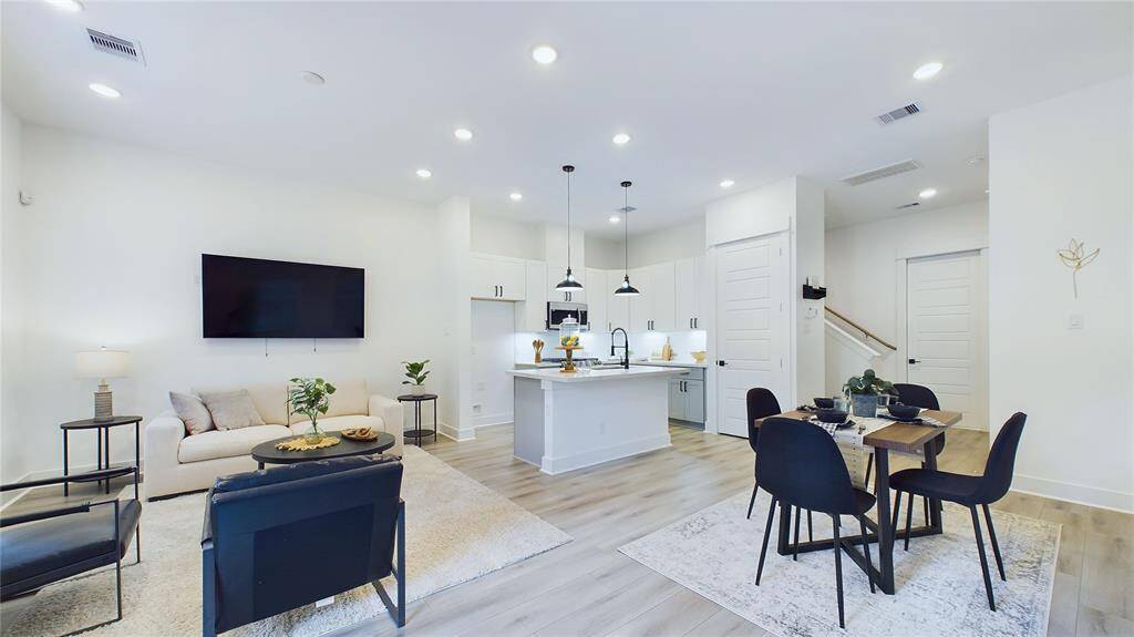Open concept area with access to the backyard, perfect for entertaining and family gatherings.