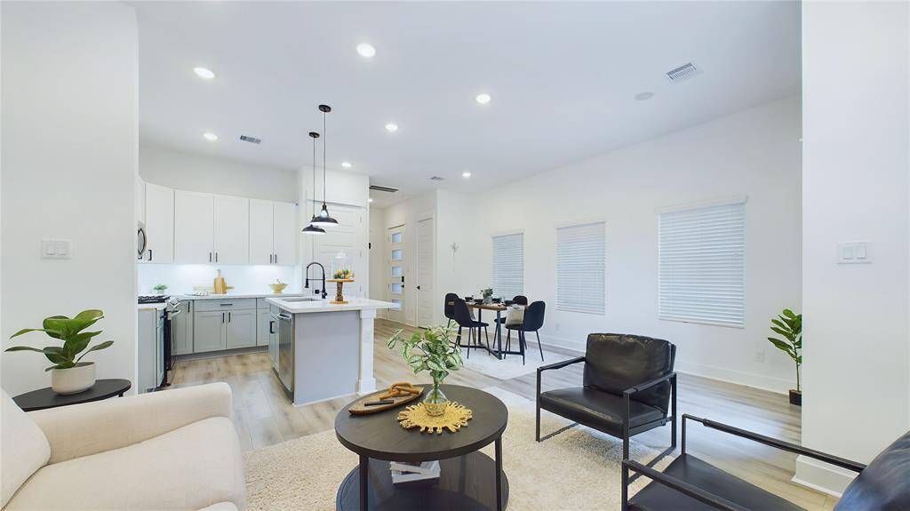 Open concept area with access to the backyard, perfect for entertaining and family gatherings.