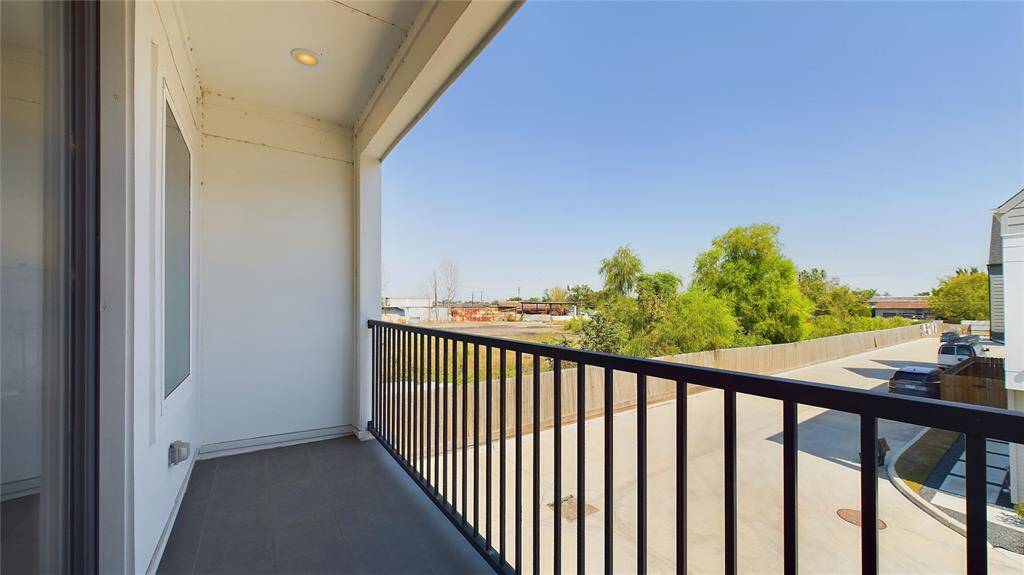 A beautiful balcony adjoins the primary bedroom