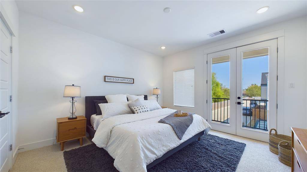 A beautiful balcony adjoins the primary bedroom