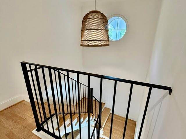 The 2nd floor Primary Bedroom is 19x15 with a large, private balcony set in the treetops.