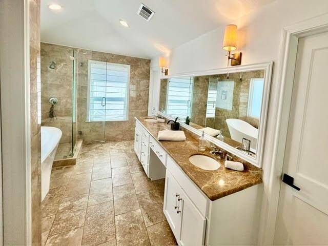Enjoy the soft breezes on the private balcony off your new Primary Bedroom.  It overlooks the backyard and pool.