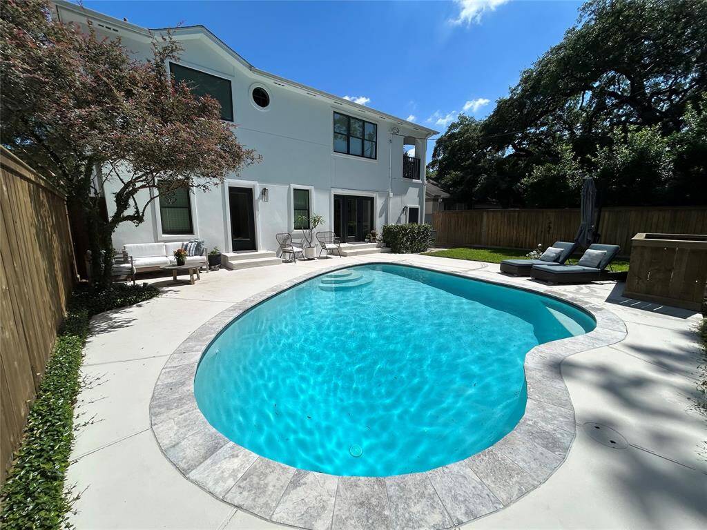 The dappled afternoon sun offers plenty of shade to cover the pool and yard.