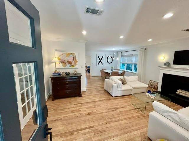 With a view towards the front of the home, one can appreciate the easy flow. It's perfect for entertaining.