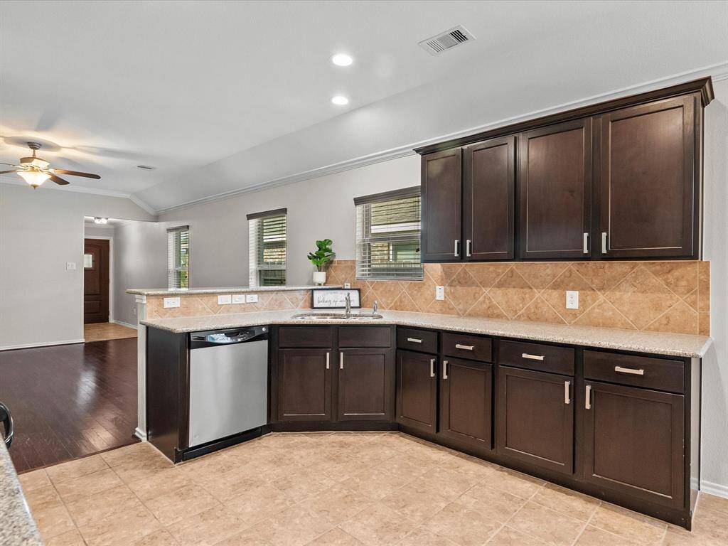 Ample cabinet space offers plenty of room to stay organized - where style meets everyday function in the heart of the home.