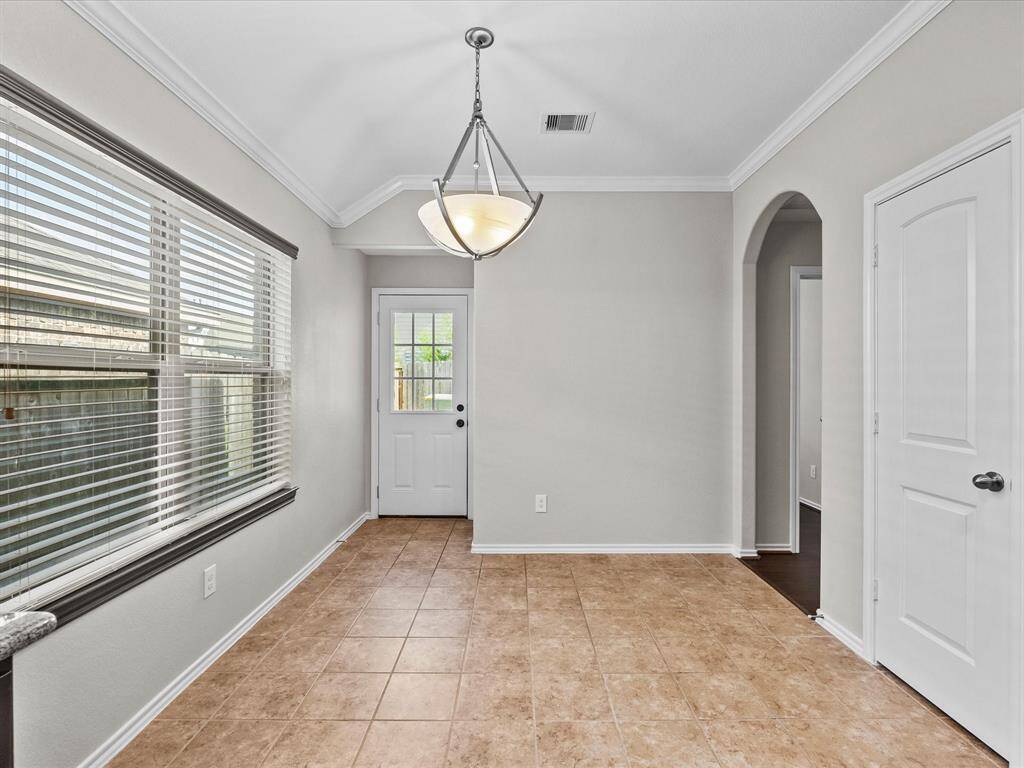 A bright breakfast nook with easy access to the back porch - perfect for casual meals and stepping out to enjoy the fresh air.