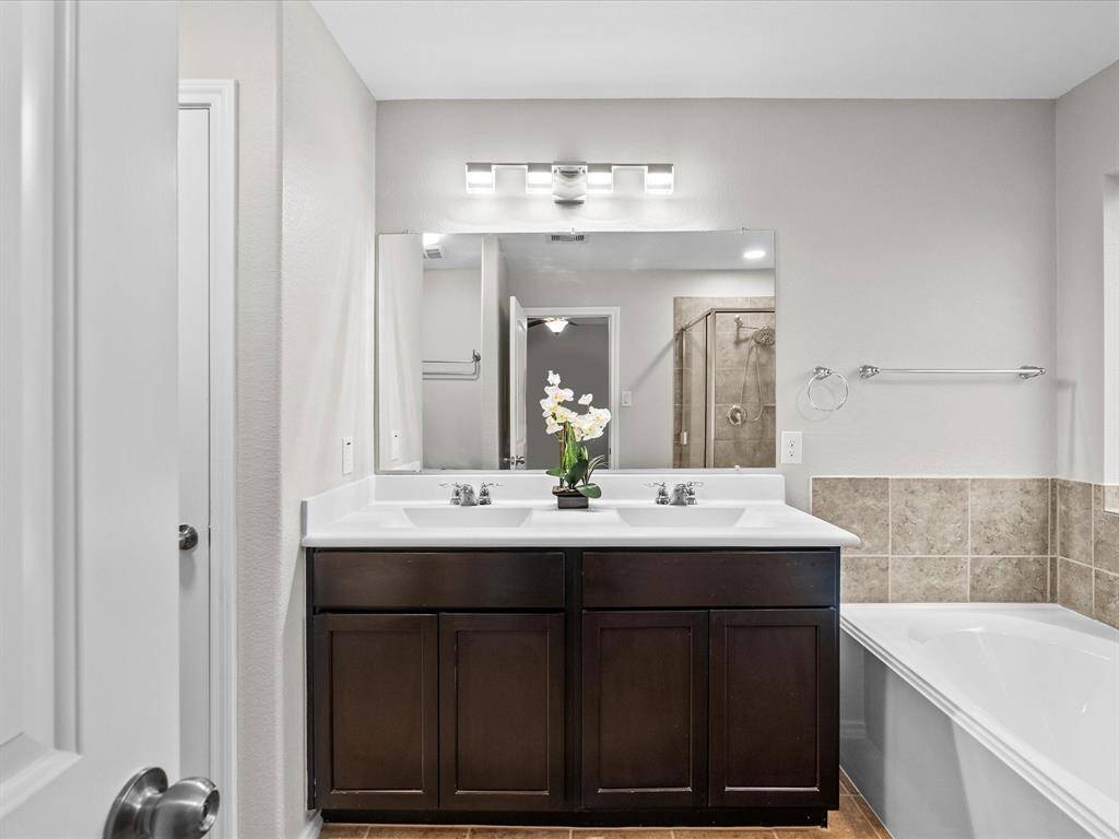 The en suite bathroom offers a double sink vanity - perfect for busy mornings or getting ready side by side in comfort