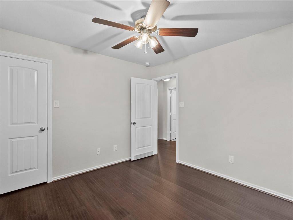 Another look at the same bedroom, showing door to the walk-in closet