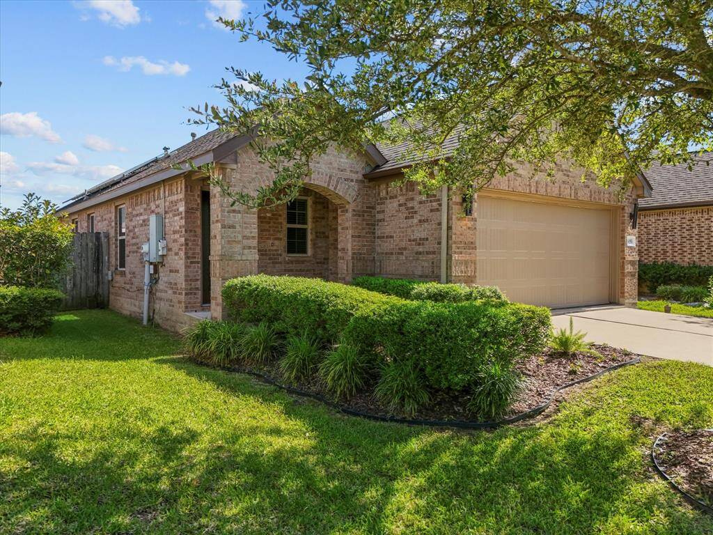 Lush landscaping that leads you to the inviting front porch